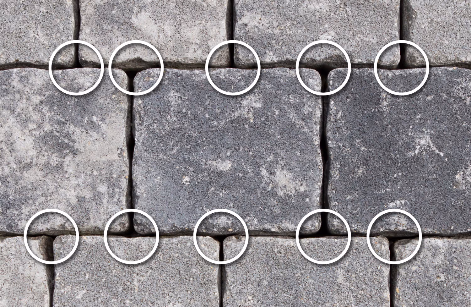Close-up of gray stone bricks with white circles highlighting cracks in the joints between them. PLATTENFIX VARIO Stelzlager höhenverstellbar mit Gewindetechnik für Terrassengefälle